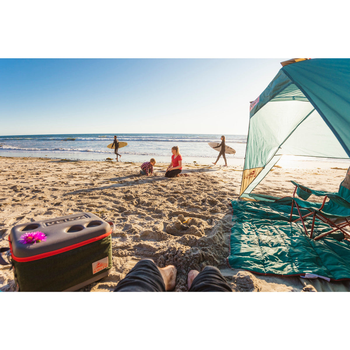 Family at beach enjoying the Cabana shelter.
