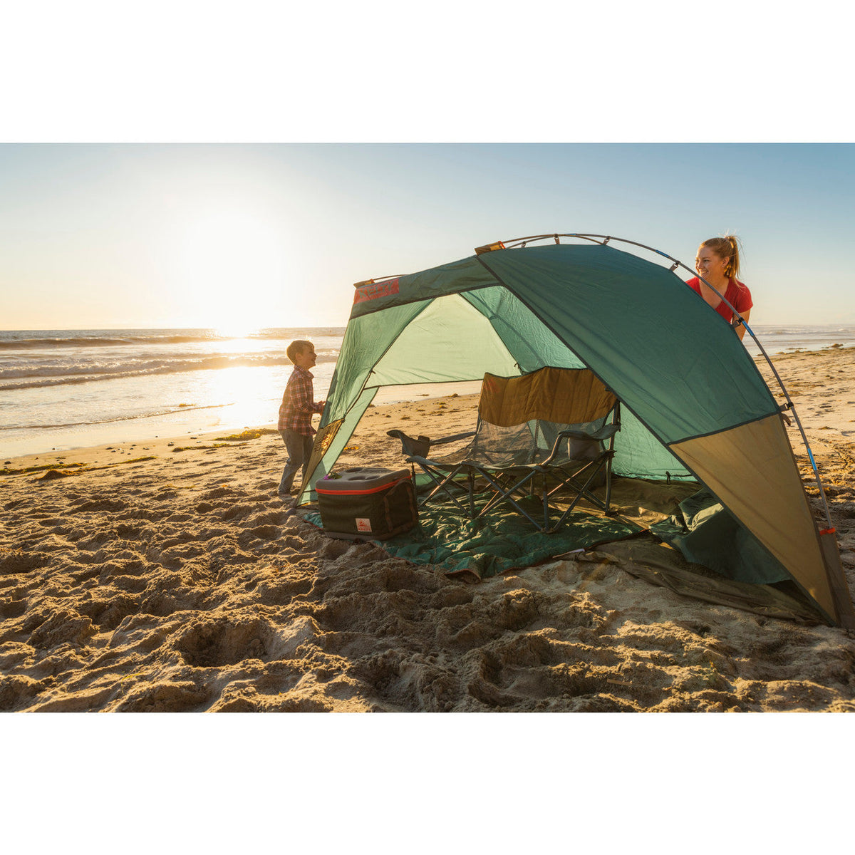 Mother and Child playing hide and seek around the Cabana shelter.