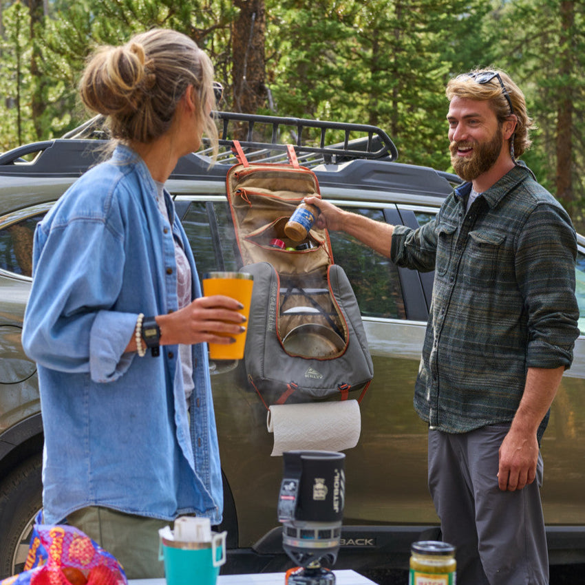 Campers with Kelty Camp Galley Deluxe on the side of their vehicle
