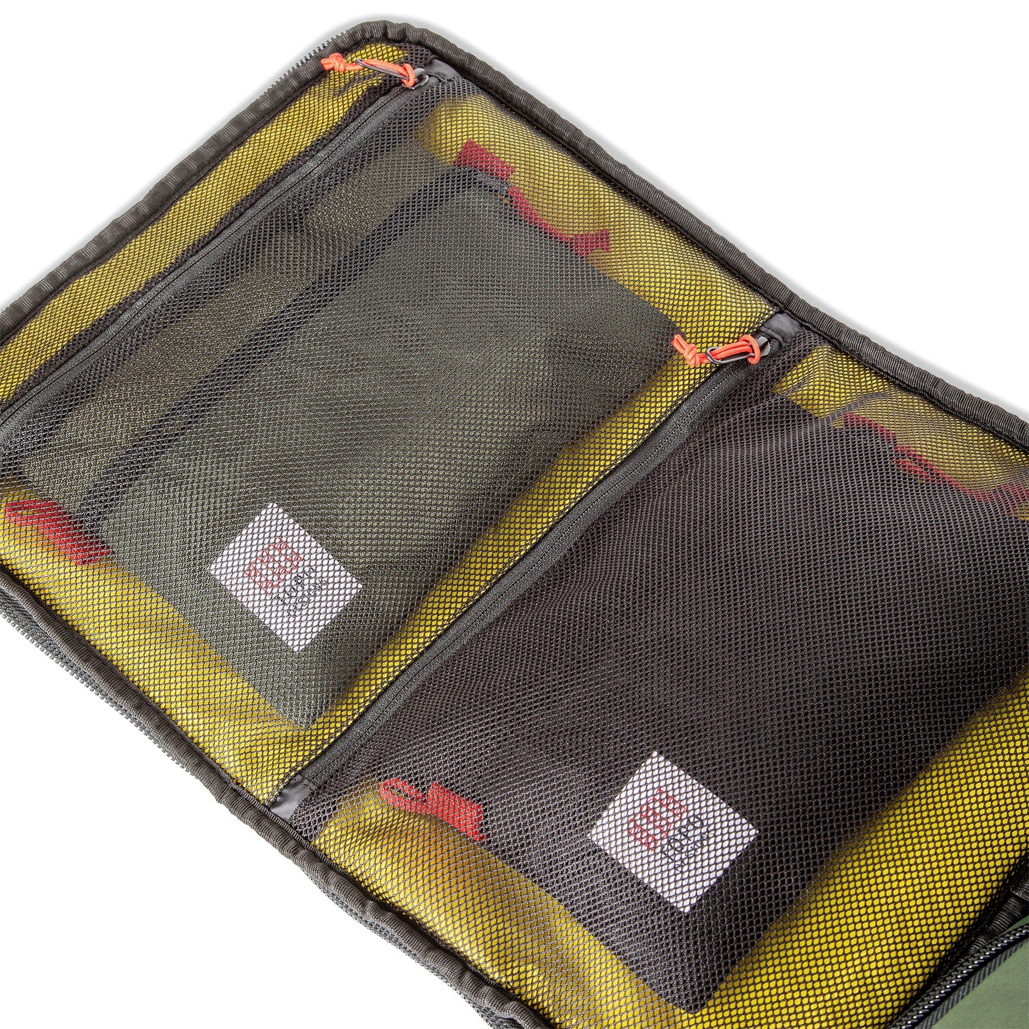 Interior mesh pockets of Topo Designs Global Travel Bag 30L Durable Carry On Convertible Laptop Travel Backpack in Navy blue.