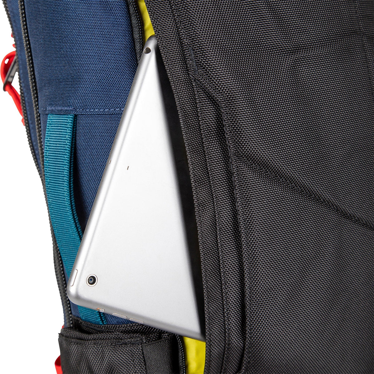 External access laptop sleeve on Topo Designs Global Travel Bag 30L Durable Carry On Convertible Travel Backpack.