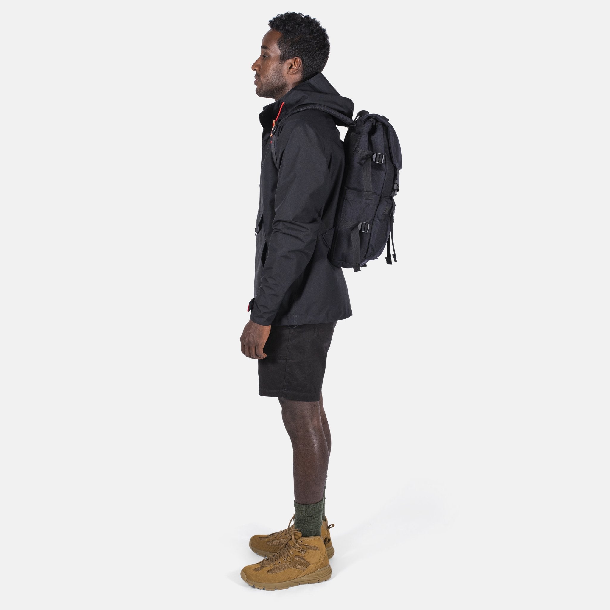 Side Model Shot of the Topo Designs Rover Pack Tech in Black