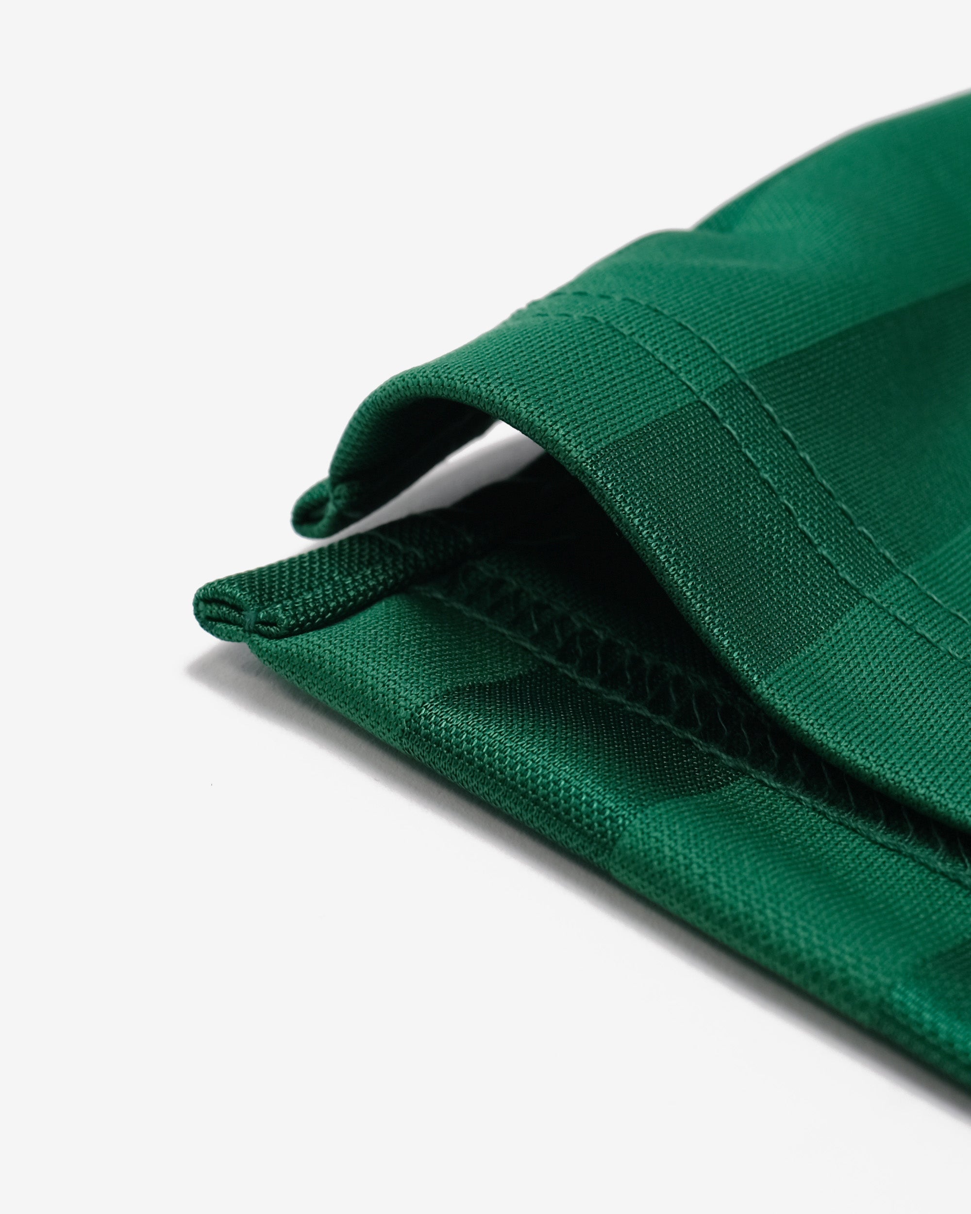 Close-up of a green cap on a white background