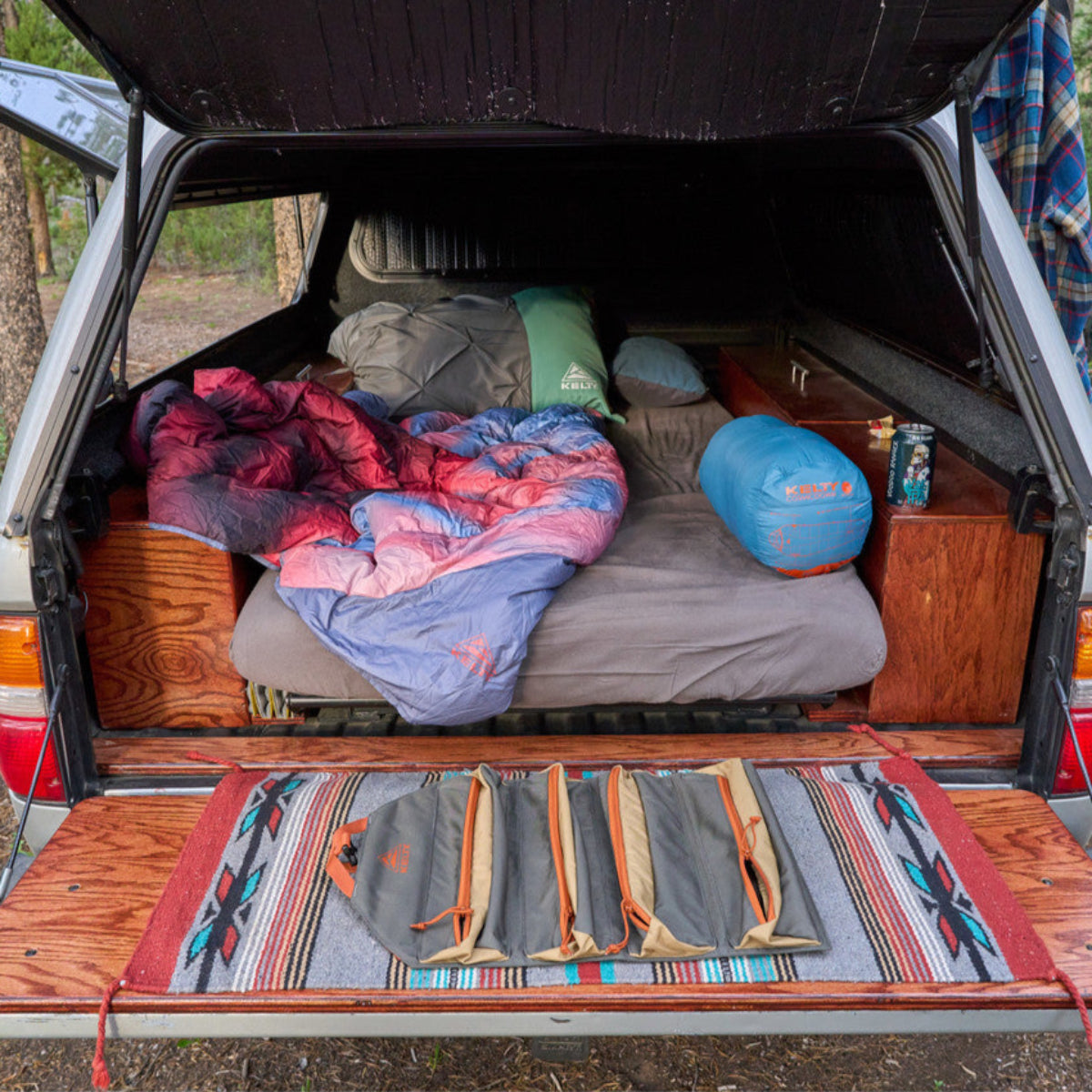 Kelty Chef Roll shown unrolled on the tailgate of an SUV