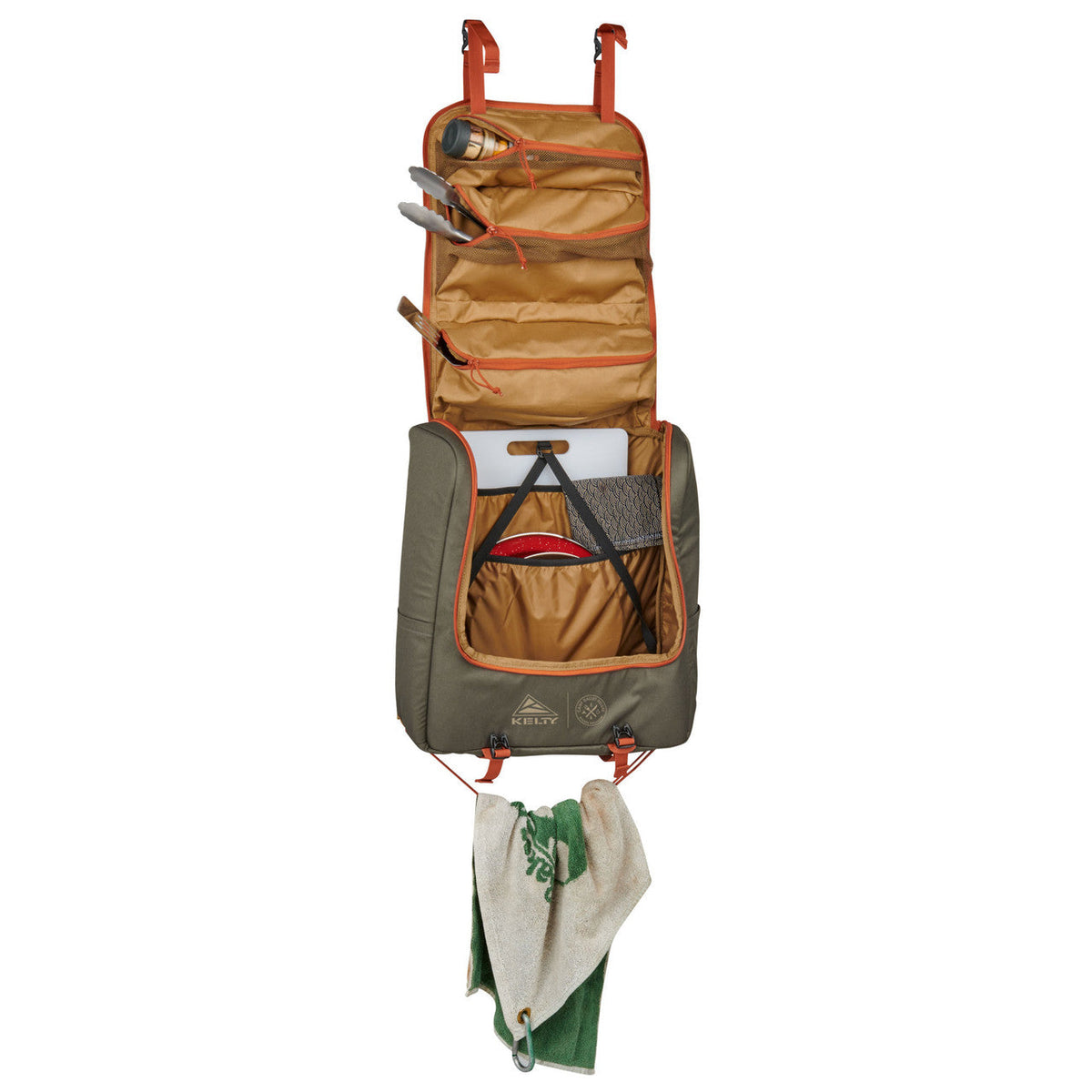 Kelty Camp Galley Deluxe, front view, opened, with kitchen supplies in pockets and towel hanging from bottom