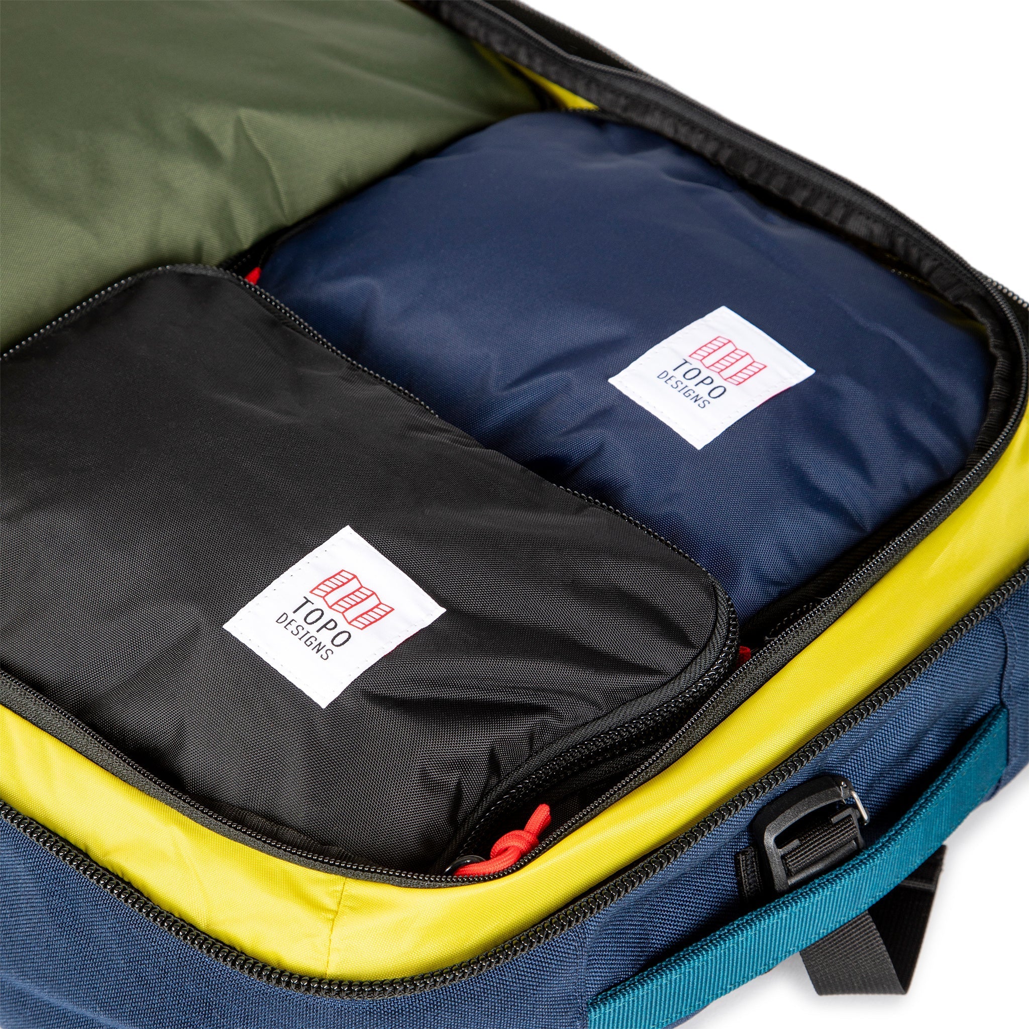 Pack Bags inside Topo Designs Global Travel Bag 40L Durable Carry On Convertible Laptop Travel Backpack in Navy blue.
