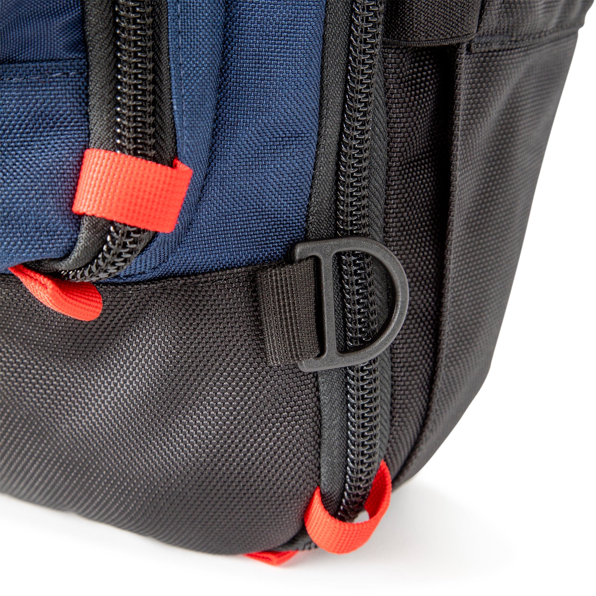 Topo Designs Global Travel Bag 40L Durable Carry On Convertible Laptop Travel Backpack in Navy blue showing attachment points and locking zippers.