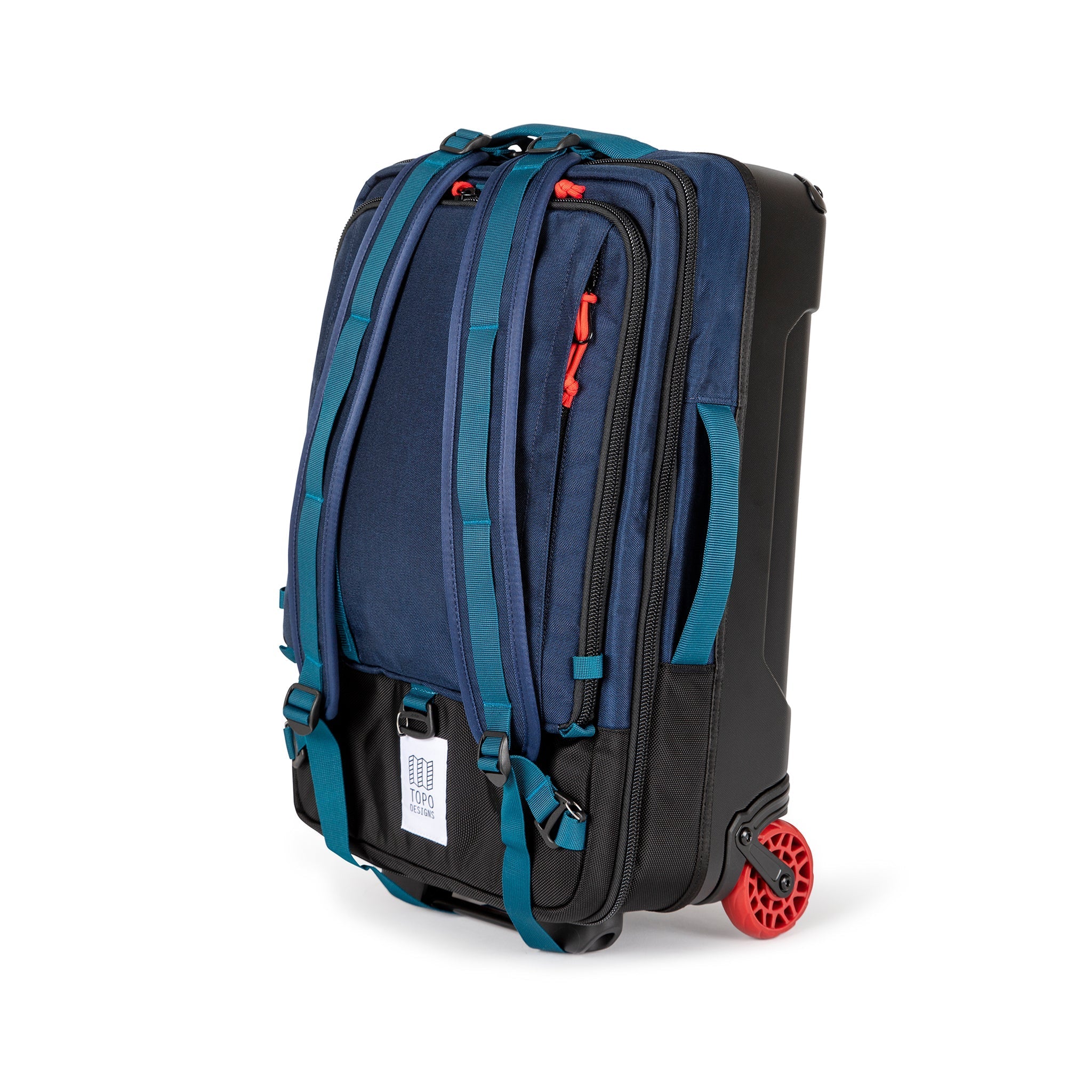 Backpack straps on Topo Designs Global Travel Bag Roller durable carry-on convertible laptop rolling suitcase in Navy blue.